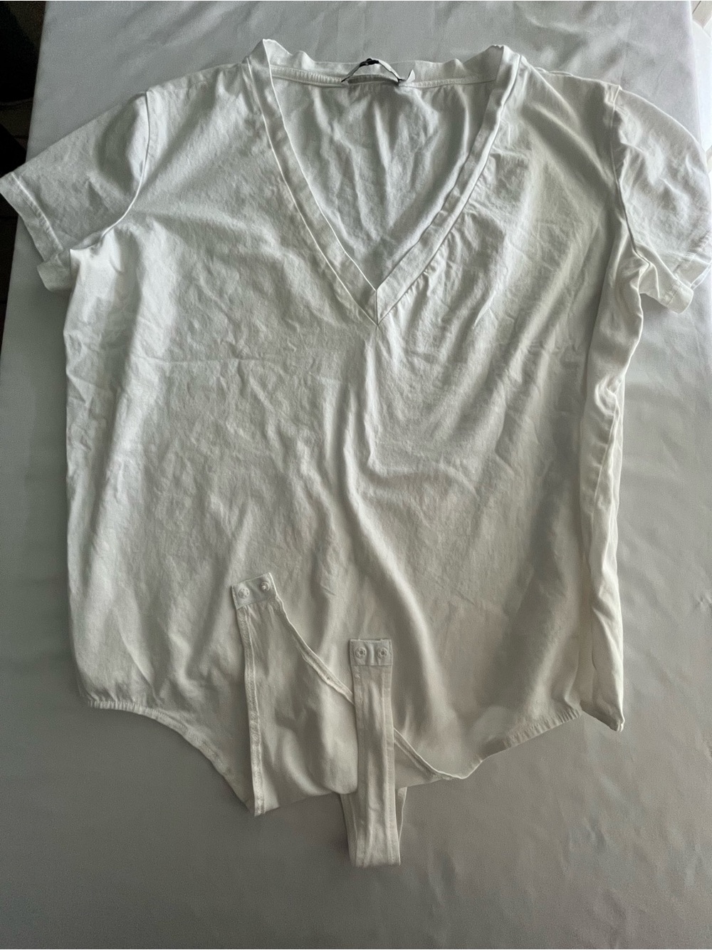 By Egreis White V-Neck Bodysuit t shirt never worn.